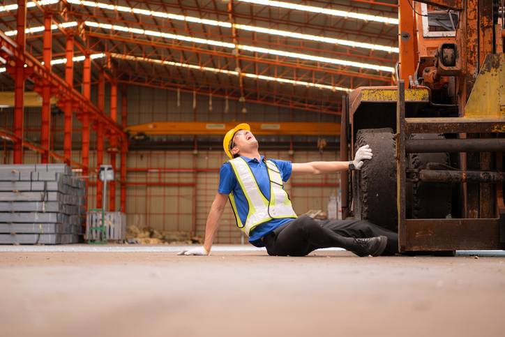 Forklift accident causing workplace injury at a construction site